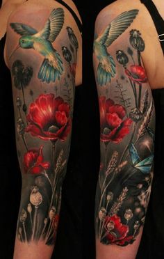 a woman's arm with tattoos on it and flowers in the background, including a bird