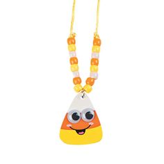 an orange and white necklace with a yellow bead on the bottom, featuring a cartoon character