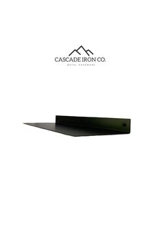 a black shelf sitting on top of a white wall with the words cascade iron co above it