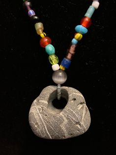 This necklace is made with a beautiful hagstone collected at the Oregon coast strung with vintage glass and ceramic love beads. It is 21.5 inches long with a 2 inch drop. Recycled Necklaces, Coos Bay, Oregon Coast, Love Necklace, Moon Stone, Charm Necklace, Necklace Etsy, Oregon, Necklace Lengths