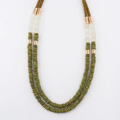 Add a pop of color to your wardrobe with the Jaylene Wood Bead Necklace. Featuring multiple strands of green, white, and natural wooden beads, this necklace is sure to make a statement. L: 26" Grasshopper Green Multi-strand Wooden Beads Jewelry, Presents For Wife, Wood Bead Necklace, Pop Of Color, Unique Earrings, Beaded Chain, Bead Necklace, Wooden Beads, Wood Beads