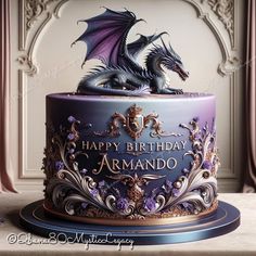 a birthday cake with a dragon on top and the words happy birthday armada written in gold