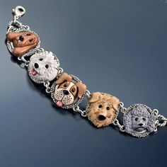 a bracelet with four different dogs on it