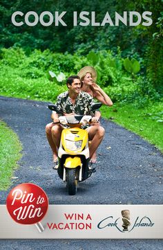 a man and woman riding on the back of a scooter down a road