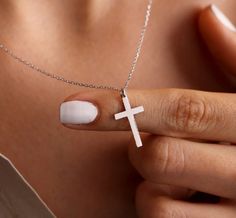 Experience the timeless beauty of our Cross Silver pendant necklace. Crafted with sterling silver, this 18 inch necklace boasts a stunning cross pendant that adds a touch of elegance to any outfit. A perfect addition to your jewelry collection! White Cross Pendant Necklace With Clavicle Chain, White Cross Necklace With Clavicle Chain, White Clavicle Chain Cross Jewelry, White Cross Collar Necklace, Silver Minimalist Cross Necklace With Clavicle Chain, White Cross Necklace With Medium-length Chain, White Cross Pendant Clavicle Necklace, Elegant Sterling Silver Crucifix Necklace, Silver Cross Necklace With Clavicle Chain