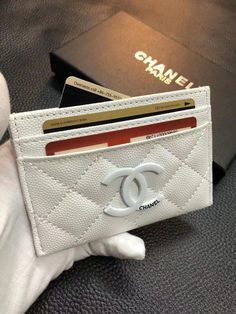 Discover the epitome of sophistication with the Luxury Chanel Classic Wallet Card Holder. Crafted with iconic design and superior craftsmanship, this accessory blends timeless style with practicality. Elevate your ensemble with Chanel's signature quilted pattern and impeccable luxury. Bags Classy, Chanel Iphone Case, Signature Quilts, Pocket Books, Branded Wallets, Spa Design, Favorite Handbags, Quilted Pattern, Luxury Wallet