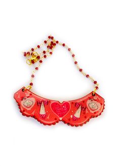 ' oh la la french Paris collar necklace' Please welcome our oh la la necklace with rosary beads! perfectly can be worn over a shirt because this baby works as a collar too! get your frilly lilly on and look simply delicious  with this unusual piece. Necklace basics * Measurements - 7cm x 5cm bib.. 18 inch rosary ruby red chain from Italy. * Illustrated piece featuring french shoes and perfume bottles. * Big love heart stating 'Paris mon amore'  * Rosary style beads with gold plated lobster clasp Cute Red Necklace For Parties, Cute Necklaces For Mother's Day Party, Cute Necklaces For Valentine's Day Party, Cute Valentine's Day Party Necklaces, Handmade Red Necklaces For Birthday, Handmade Pink Bib Necklace As A Gift, Red Necklace For Valentine's Day Birthday, Handmade Pink Bib Necklace For Gifts, Handmade Red Necklace For Birthday