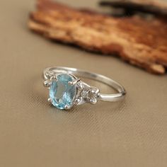 1.06 Cts Oval Aquamarine Ring, 925 Solid Silver, Precious Gemstone Ring, Diamond Ring, Aquamarine Engagement Ring, Stacking Ring for Gift ★ PRODUCT DETAILS ★ * SKU:- RG-1805-AQ-D3 * Product:- Ring * Metal:- Sterling Silver * Metal Purity:- 925 *  Ring Weight:- 1.93 Gms (Approx.) ★ STONE DETAILS ★ *  Stone Name:- Aquamarine & Diamond  *  Stone Shape:- Oval & Round *  Stone Size:- 8x6mm *  Stone Weight:- 1.06 CTS (Approx.) *  Stone Color:- Sky Blue  *  Stone Cut:- Faceted *  Birthstone:- March Cli Anniversary Oval Blue Topaz Diamond Ring, Oval Blue Topaz Diamond Ring, Oval Topaz Promise Ring With Center Stone, Oval Topaz Gemstone Ring For Anniversary, Oval White Gold Topaz Birthstone Ring, Oval White Gold Topaz Solitaire Ring, Oval Blue Topaz Birthstone Ring For Anniversary, Oval Solitaire Topaz Ring In White Gold, White Gold Oval Solitaire Topaz Ring