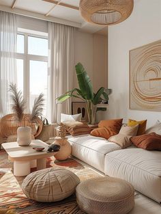 a living room filled with lots of furniture next to a large window covered in curtains