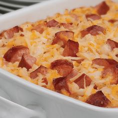 a casserole dish with bacon and cheese in it