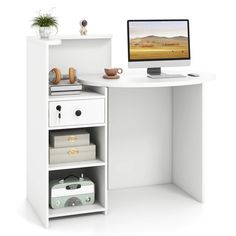 a white desk with a computer on top of it and some drawers underneath the desk