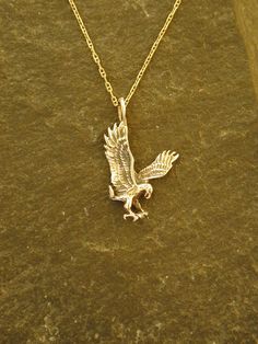 "The Eagle pendant is 14K Gold. This Eagle pendant measures 1\" tall by 5/8\" across. You my choose a 16, 18 or 20\" 14K Gold Chain. I hand cast all my pieces using the lost wax casting method. Please ask your needs. You may call me with questions, often I am out so please use my machine. 831-476-3176. Satisfaction Guaranteed! This piece ships USPS First Class Insured  I send items USPS First Class unless otherwise directed. I send as soon as I can, usually in one to five days. I do shows and am Hand Cast Pendant Jewelry For Anniversary, Hand Cast 14k Gold Jewelry, Hand Cast Sterling Silver Gold Jewelry, Hand Cast Gold Sterling Silver Jewelry, Eagle Pendant, Eagle Necklace, Gold Eagle, Bird Pendant, Wax Casting