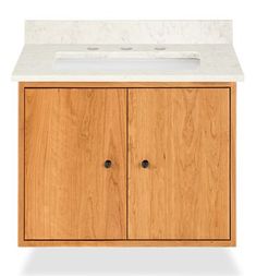 a wooden cabinet with a white counter top