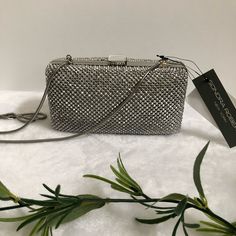 Sondra Roberts Box Silver Rhinestone/Satin Clutch, Nwt Color: Silver Hardware: Silver-Tone Interior: 1 Credit Card Pocket Closure: Push Snap Closure Dimensions: Mini Sized Clutch Bag: 6.5”W X 3.25”H X 1.75”D Crossbody Chain Strap: 24”L Condition: New With Tag; Chain Tab Slightly Bent In Middlesee Last Photo Elegant Bedazzled Rectangular Evening Bag, Silver Bedazzled Evening Bag, Formal Evening Bag With Rhinestones, Formal Bedazzled Rectangular Evening Bag, Satin Clutch, Mini Crossbody Bag, Silver Rhinestone, Mini Crossbody, Silver Hardware