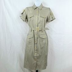 Nwot Calvin Klein Khaki Utility Dress Excellent Tailored Excellent Condition Minor, Unnoticeable Flaws New Without Tags Gold Snap Button Down Closure Collared Short Sleeve 4 Pockets, Gold Snap Button Closures Cinch Tie Waist Color: Tan 98% Cotton 2% Spandex Dry Clean Stylish & Trendy Classy & Sophisticated Great For Any Occasion Stunning Gold Button & Buckle Accents Look Amazing & Feel Amazing In Your Nwot Calvin Klein Button Down Short Sleeve Cinch Tie Waist Dress! Size 2 Classic Beige Shirt Dress With Button Closure, Beige Shirt Dress With Button Cuffs For Work, Fitted Belted Beige Shirt Dress, Beige Fitted Collared Shirt Dress, Fitted Collared Beige Shirt Dress, Fitted Beige Shirt Dress With Pockets, Spring Calvin Klein Dress With Button Closure, Calvin Klein Spring Dresses With Button Closure, Khaki Short Sleeve Dresses With Buttons