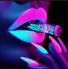 a woman's lips and nails with neon lights on them, while the image is lit up