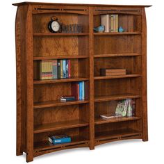 a wooden bookcase with several shelves and books on it's sides, including an alarm clock