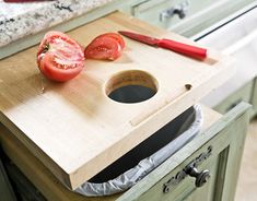 a cutting board with some tomatoes on it