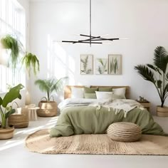 a bedroom with white walls and lots of plants on the floor, including palm trees