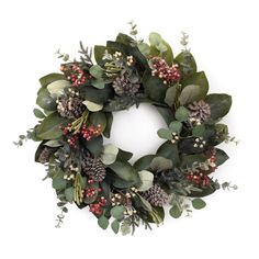 a wreath with greenery, berries and pine cones