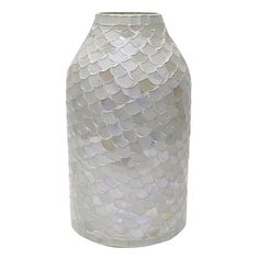 a white vase with fish scales on it