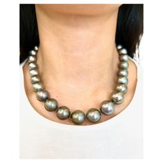 This beautiful and elegant natural Tahitian black pearl necklace features 99 diamonds weighing 2.83 ct set in 18k white gold. The pearls are between 12 mm and 15.80 mm thick. A stunning piece to add to any wardrobe. Tahitian Black Pearl Necklace, Black Pearl Necklace, Tahitian Black Pearls, Tahitian Pearls, Black Pearl, Pearl Necklace, Black Women, Beaded Necklace, Jewelry Necklaces