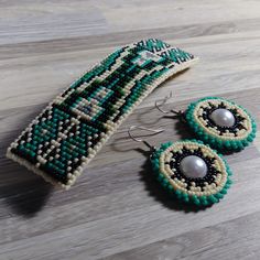 Storm Navajo Rug design beaded hair barrette and matching earrings. Free First Class Shipping, and it ships the next day after you order it. This hair barrette is approximately 4.75 inches long and 1.25 inches wide. The hair barrette is made from 1,197 seed beads. Both the hair barrette and earrings are made from size 11 seed beads. The backing is hardened steel covered with a sheep skin chamois. The earrings have a pearl cabochon center. This jewelry set was inspired by the Navajo Storm design rugs common throughout the Navajo Nation. I'm a member of the Navajo Nation and I belong to the Towering House Clan (Kinya'áanii) and Salt Clan (Áshįįh). I grew up in the Wide Ruins (Kin teel) area of the Navajo Nation. My jewelry is inspired by the Navajo rugs made by my grandmother and ancestors. Loom Designs, Navajo Rug, Bead Loom Designs, Beaded Hair, Design Rugs, Navajo Nation, Navajo Rugs, Sheep Skin, A Sheep