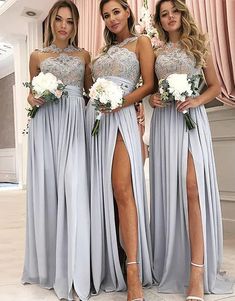 three bridesmaids in grey dresses posing for the camera