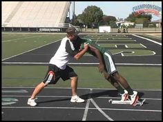 two men are playing frisbee on the field