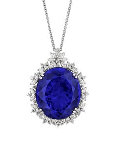 A magnificent blue tanzanite weighing an astonishing 88.00 carats and displaying its prized, highly-saturated violetish-blue hue is the focus of this captivating pendant necklace. Found in just one place on earth, the African country of Tanzania for which it is named, the tanzanite is relatively new to the jewel market. Its intense color is perfectly complemented by a halo of approximately 1.50 total carats of round, marquis and pear-shaped diamonds in its 18K white gold setting. When discovered Tanzanite Pendant, Tanzanite Necklace, Big Necklace, Jewelry For Sale, Semi Precious Gems, Antique Pendant, Blue Tanzanite, Blue Gems, Unique Diamonds