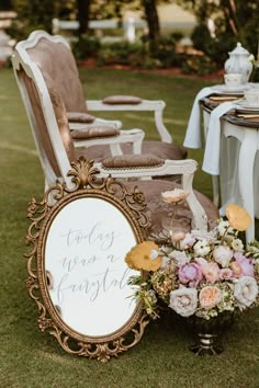 there is a sign that says today was a fairy tale next to some chairs with flowers on them