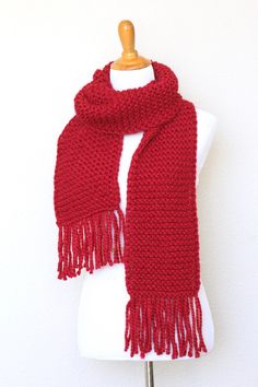 This chunky knit scarf is a cozy addition to any modish fall/winter wardrobe. It's made with wool blend yarn in lovely red (Cranberry) color.The scarf is long, soft and comfy.Please note: I can make this scarf in many other colors. Just contact me for more info.Shown color: Cranberry.Machine wash and dry when needed. Red Knitted Scarf For Winter, Red Knitted Scarf For Fall, Red Knitted Fall Scarf, Red Knitted Fall Scarves, Cozy Red Scarves For Winter, Red Crochet Scarf, Red Scarf, Mens Knitted Scarf, Chunky Knit Scarves