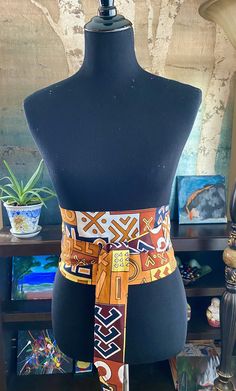 "Long African print belt in vibrant colors. This Ankara belt will be specially handcrafted for you upon purchase. The fabric is high-quality African print, 100% cotton. Choose from a variety of colorful prints. These are creative ways to add a pop of color to your wardrobe and enhance your style! Our gorgeous waist sash is double-sided and reversible. Can also be made in 2 different colors for double the fun - just let us know! This Obi belt allows for a variety of ways to wear: Rock this sash w Adjustable Handmade Multicolor Belt, Adjustable Artisan Multicolor Belt, Artisan Multicolor Fabric Belt, Handmade Multicolor Belts For Festival, Handmade Multicolor Belt For Festivals, Ankara Belt, African Skirts, Waist Sash, Beautiful Belts