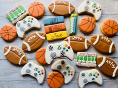 decorated cookies with video game controllers and basketballs on them are arranged in the shape of balls