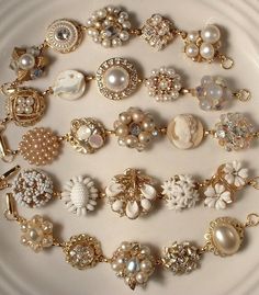 a white plate topped with lots of different types of jewelry