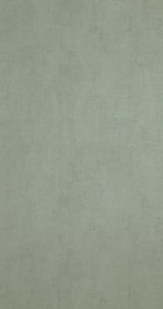 an image of a light green background that looks like it is made out of fabric