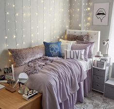 a bed room with a neatly made bed and lots of lights