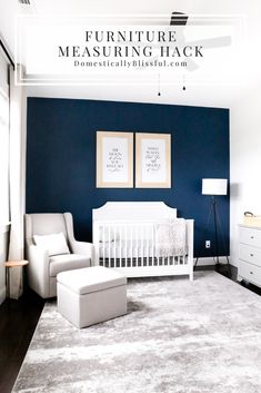 a baby's room with blue walls and white furniture