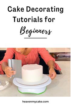 a woman is decorating a cake with white frosting and icing on it