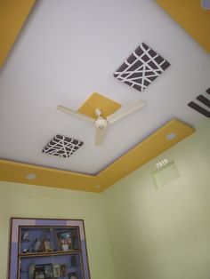 the ceiling in this room is painted yellow and white