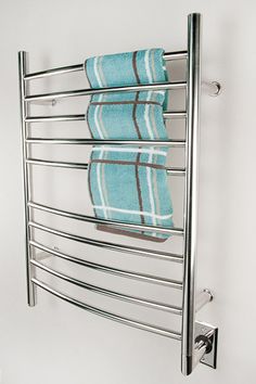 a towel rack with two towels hanging on it's side and one folded up