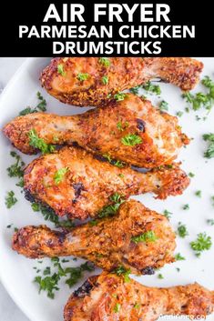 grilled chicken wings with parsley on a white plate