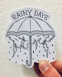 a hand holding an umbrella with rain coming out of it and the words rainy days written on it