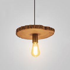 a light that is hanging from a wooden beam with a lightbulb on it