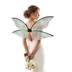 a woman in a wedding dress holding a bouquet and butterfly wings