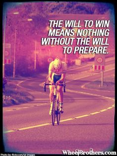 a man riding a bike down a road with a quote on the front saying, the will to win means nothing without the will to prepare