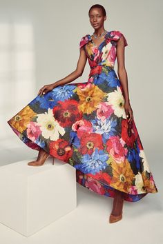 Thalia is a sensational silk special occasion gown with a beautiful, bright watercolour floral print. This piece is from The Atelier Collection by Suzannah London, and is made to order in our London Atelier. --- - Outer: 100% Silk- Lining: 100% Silk- Specialist Dry Clean Only- Made in London --- - Fits true to size- Measure your bust, waist and hips against our Size Guide- Model is 5ft 10" and wears a UK Size 8 --- Sustainable Attributes: Timeless Design; Contains Natural Fibres; High Quality It Multicolor Silk A-line Maxi Dress, Summer Gown With Floral Print And Fitted Bodice, Floral Print Gown With Fitted Bodice For Gala, Multicolor Floor-length Gown With Fitted Bodice, Elegant Multicolor Maxi Dress For Garden Party, Silk Floral Print Gown For Party, Multicolor Floral Print Gown For Spring, Floral Print Silk Gown For Party, Summer Floral Print Gown For Wedding Guest