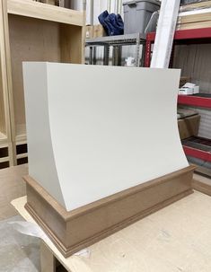 a large white piece of wood sitting on top of a table