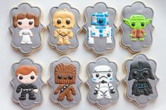 star wars cookies decorated with icing on a plate