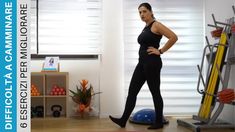 a woman standing in front of a gym equipment